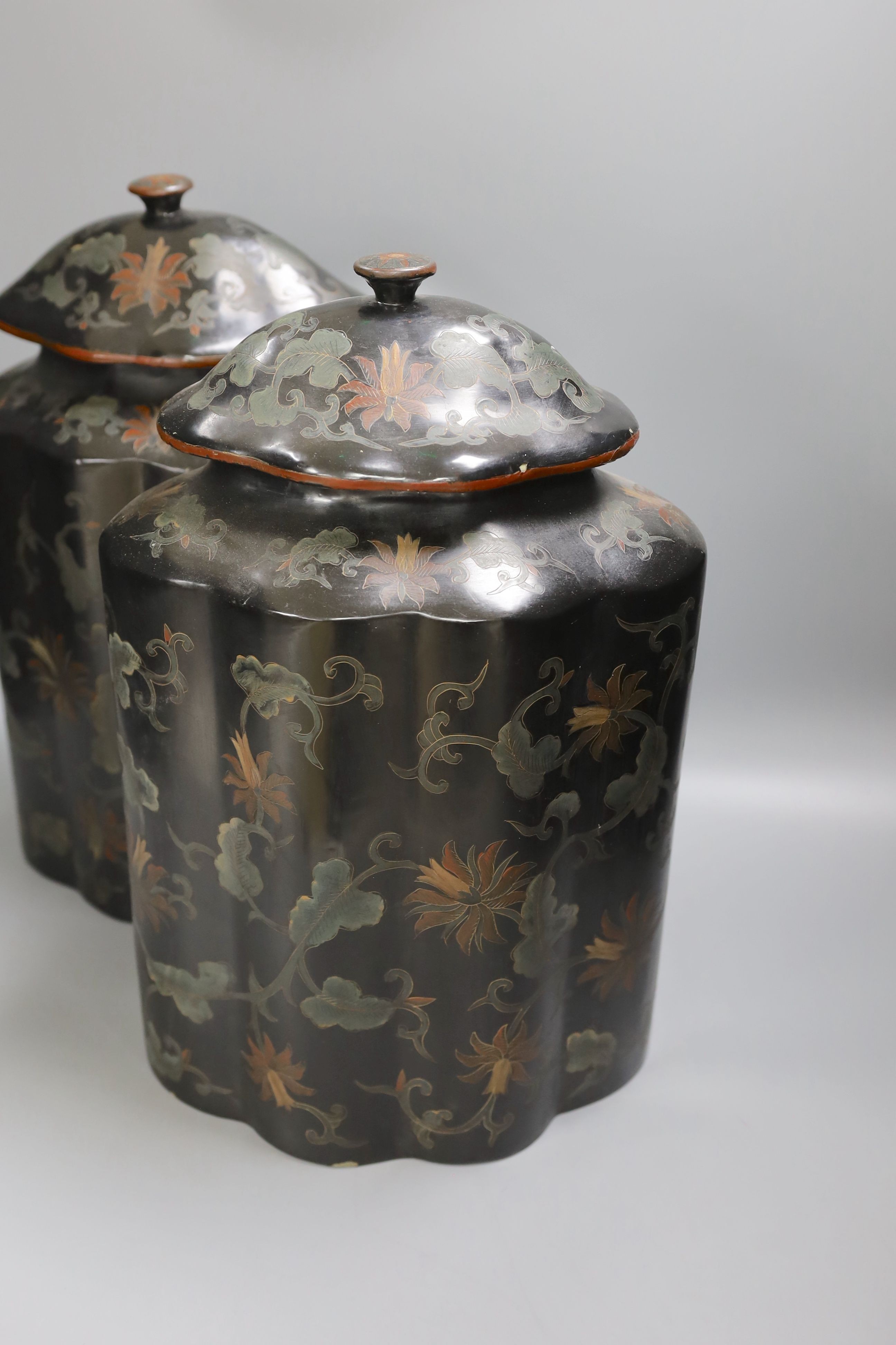 A pair of Chinese lacquered lidded tea caddies - 40cm high